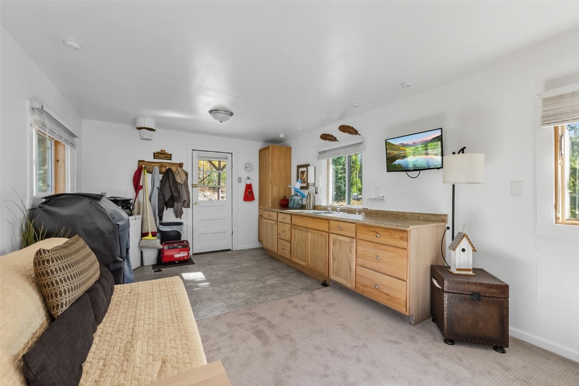 5364 Meadow Creek Road Tabernash, CO 80478 - Photo 11 of 30 a bed room with a bed and a dresser