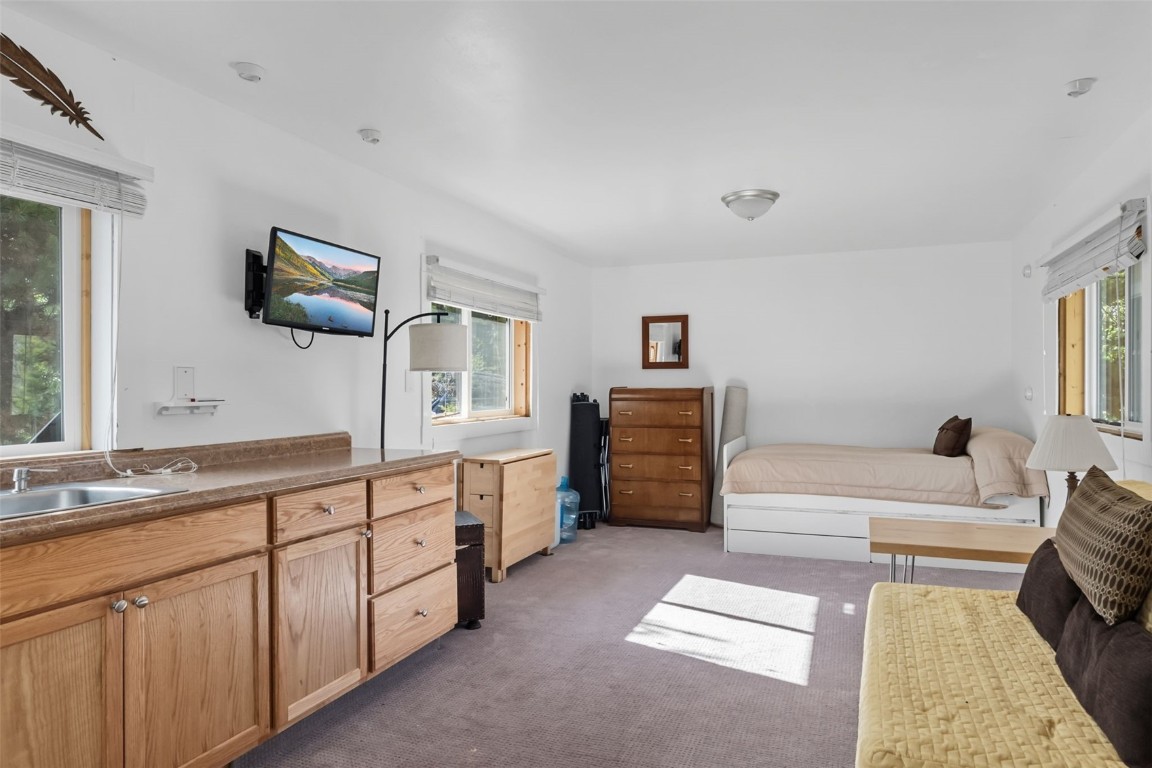 5364 Meadow Creek Road Tabernash, CO 80478 - Photo 12 of 30 a spacious bathroom with a double vanity sink a mirror and a bathtub