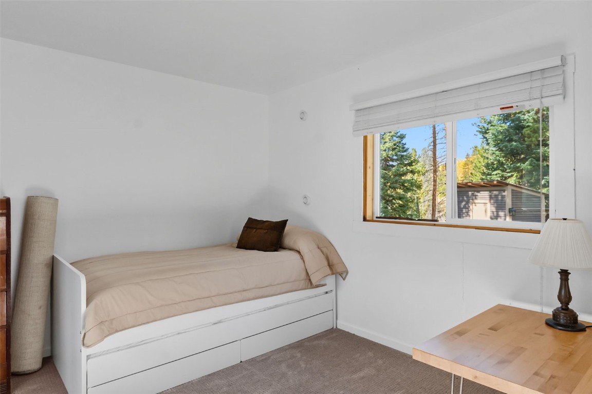 5364 Meadow Creek Road Tabernash, CO 80478 - Photo 13 of 30 a bedroom with a bed and a window