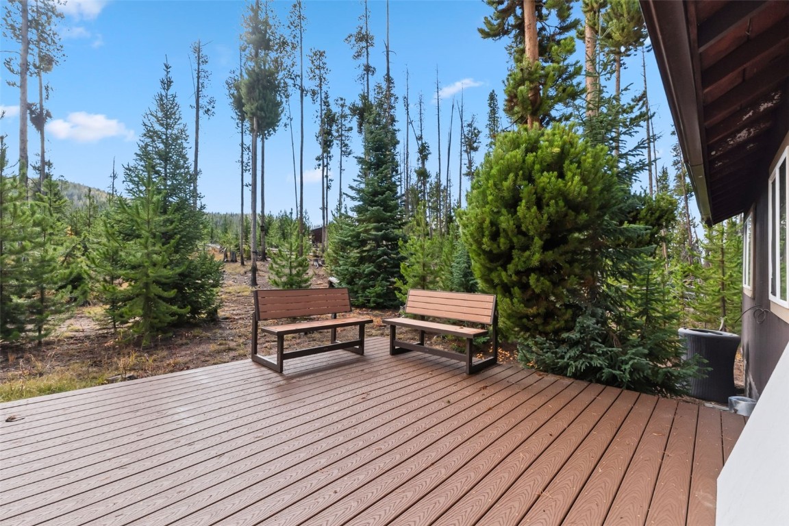 5364 Meadow Creek Road Tabernash, CO 80478 - Photo 10 of 30 a wooden bench sitting on top of a wooden deck