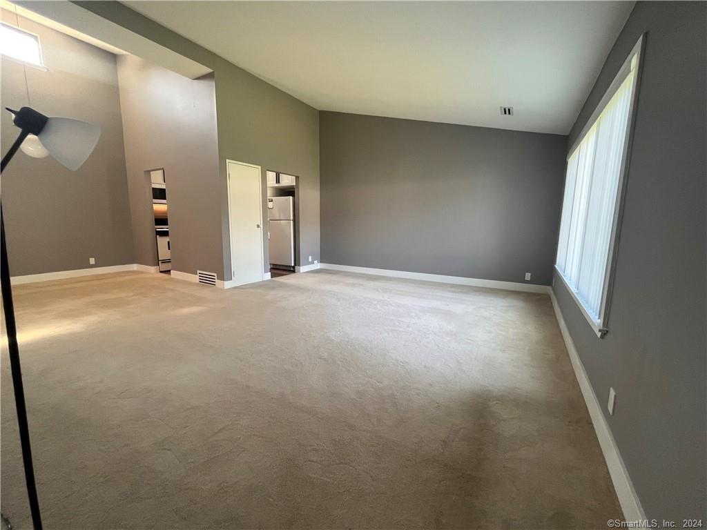 60 Olcott Way, Unit 60 Ridgefield, CT 06877 - Photo 13 of 31 a view of an empty room with a window