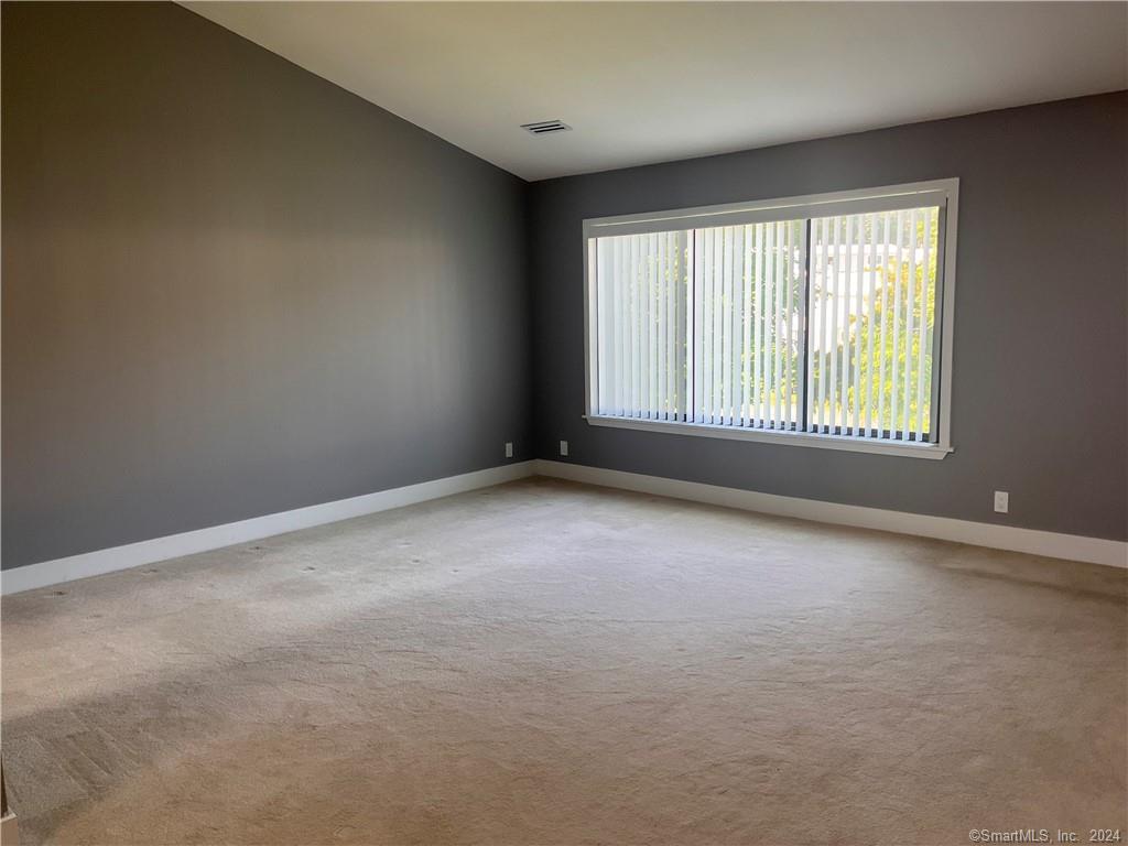 60 Olcott Way, Unit 60 Ridgefield, CT 06877 - Photo 20 of 31 an empty room with a window