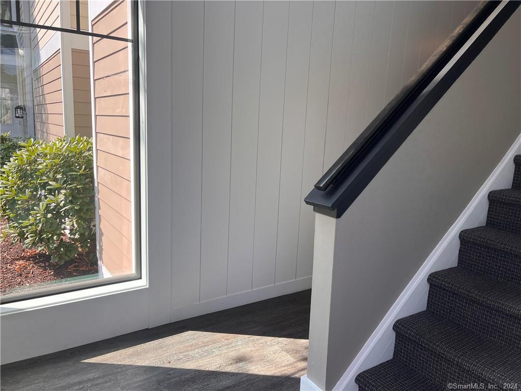 60 Olcott Way, Unit 60 Ridgefield, CT 06877 - Photo 21 of 31 a view of staircase with white walls and a window