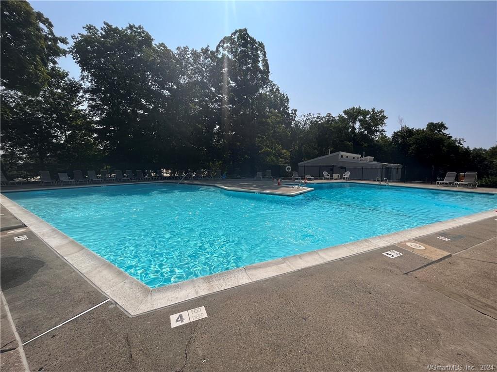 60 Olcott Way, Unit 60 Ridgefield, CT 06877 - Photo 29 of 31 a view of a backyard