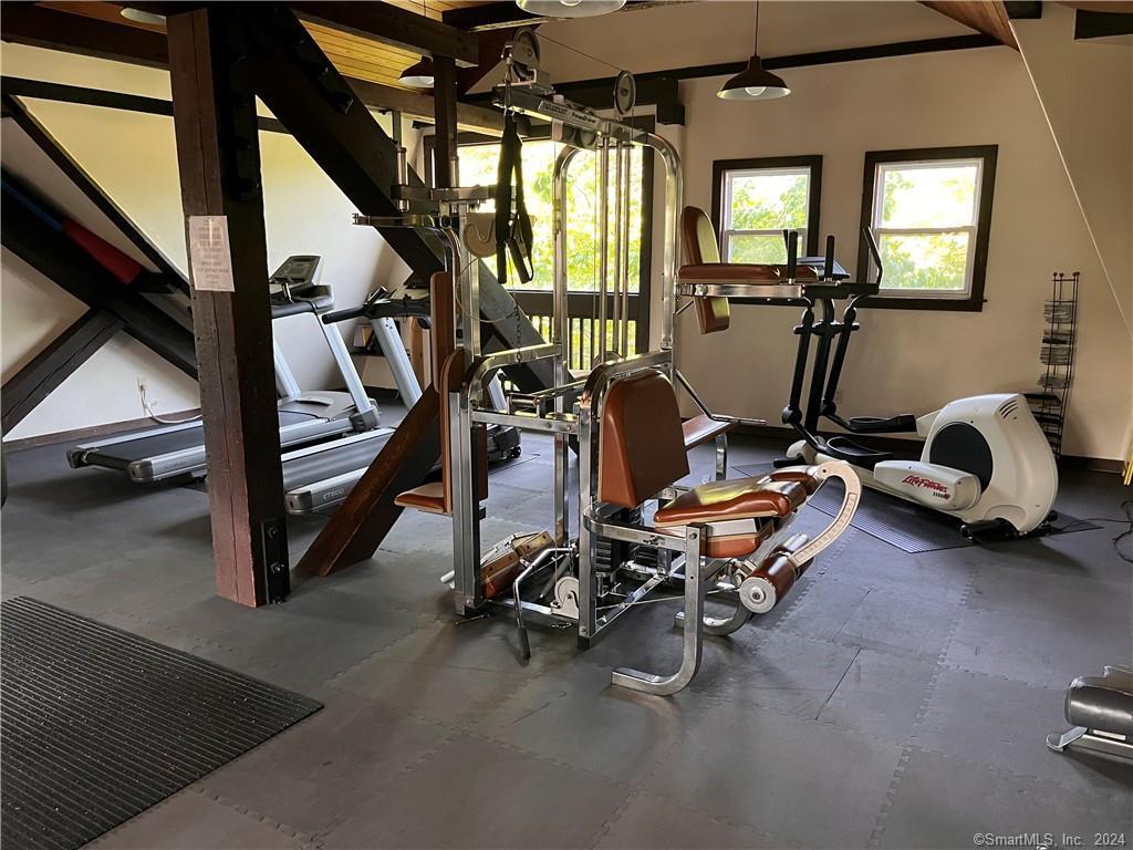 60 Olcott Way, Unit 60 Ridgefield, CT 06877 - Photo 30 of 31 a view of a room with gym equipment