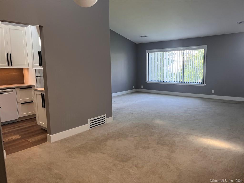 60 Olcott Way, Unit 60 Ridgefield, CT 06877 - Photo 3 of 31 a view of a kitchen with refrigerator and window