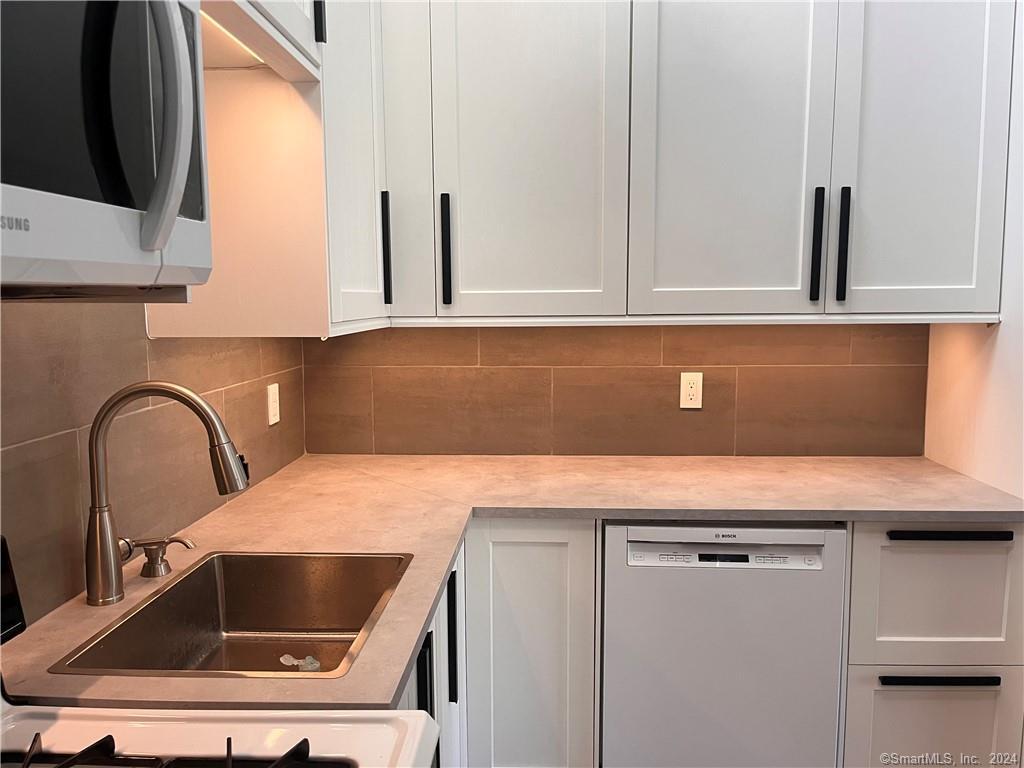 60 Olcott Way, Unit 60 Ridgefield, CT 06877 - Photo 6 of 31 a close view of sink and tap