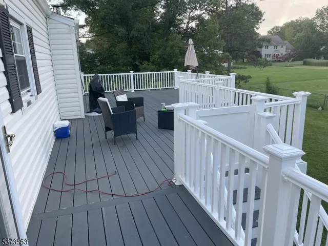 a view of a chairs on the roof deck
