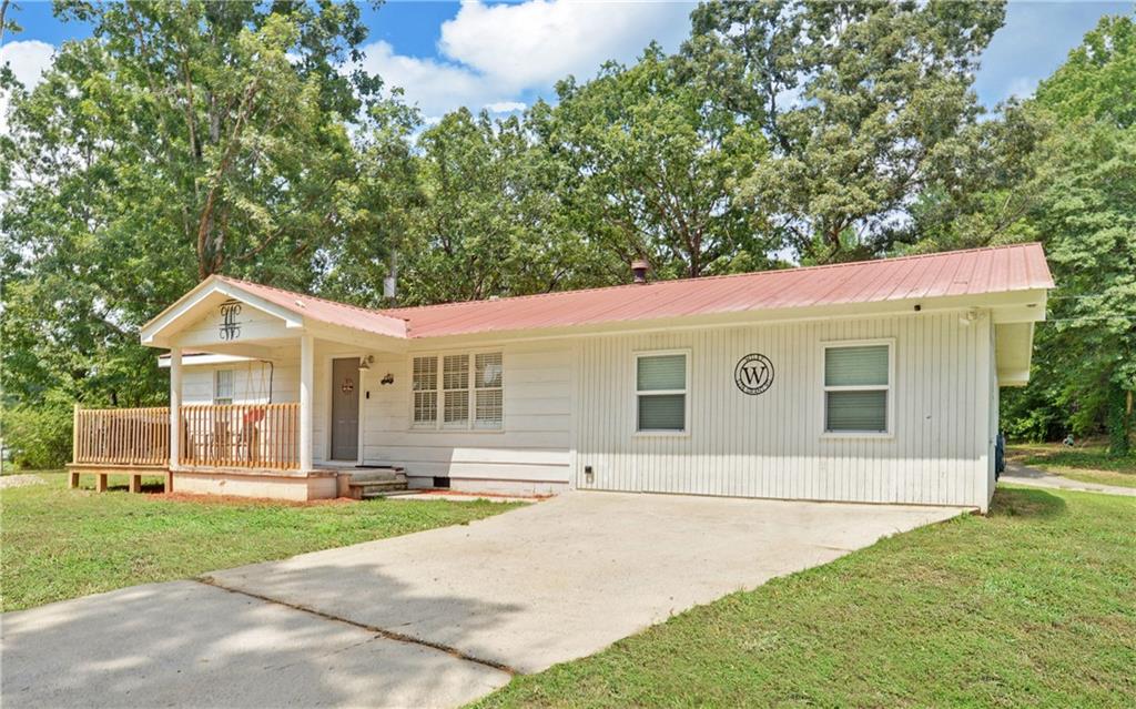 5236 Grant Road Gainesville, GA 30506 - Photo 1 of 1 a front view of a house with a yard and garage