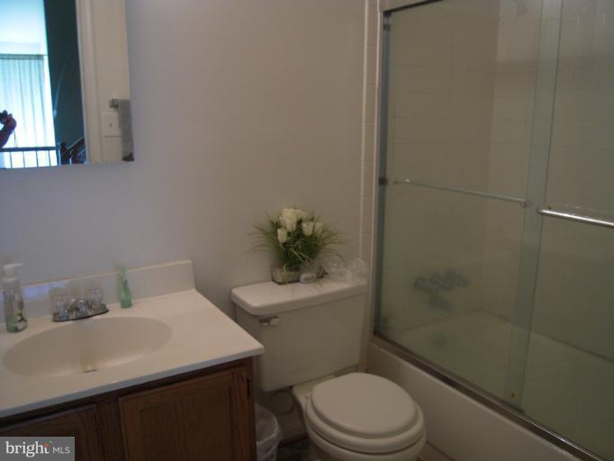 5478 Stavendish Street Burke, VA 22015 - Photo 13 of 30 a bathroom with a sink a toilet and shower
