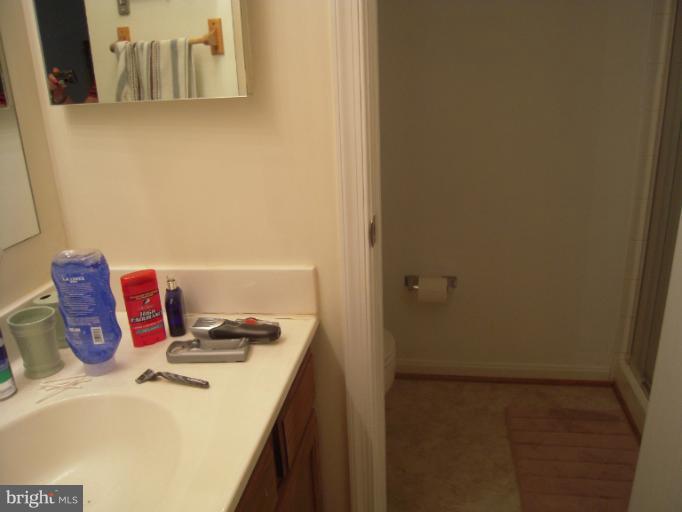 5478 Stavendish Street Burke, VA 22015 - Photo 16 of 30 a bathroom with a bathtub and shower