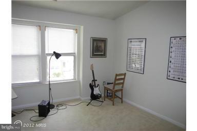 5478 Stavendish Street Burke, VA 22015 - Photo 18 of 30 a view of a workspace with furniture and a window