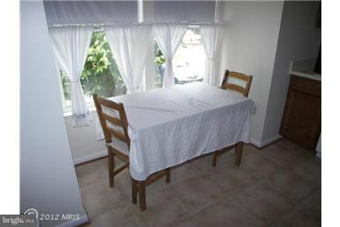 5478 Stavendish Street Burke, VA 22015 - Photo 6 of 30 a bed sitting in a bedroom next to a window