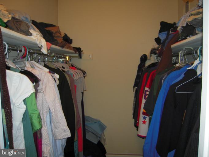 5478 Stavendish Street Burke, VA 22015 - Photo 9 of 30 a view of walk in closet with clothes and shoes