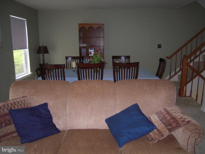 5478 Stavendish Street Burke, VA 22015 - Photo 10 of 30 a living room with furniture rug and a window