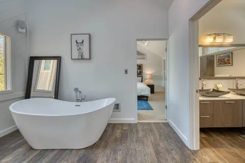 a view of a bathtub in a room and a bathroom