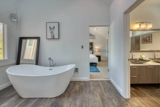 a view of a bathtub in a room and a bathroom