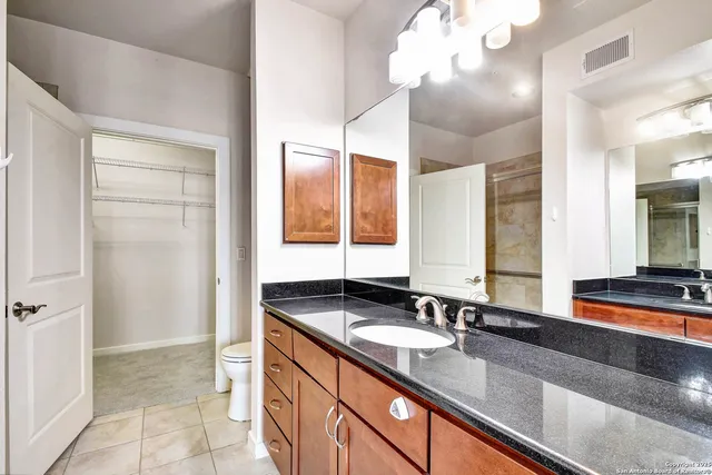 a bathroom with a sink double vanity and a mirror