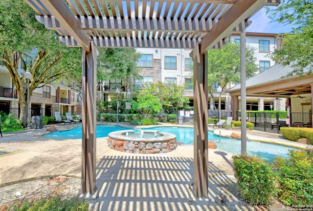 a view of a porch with chairs and table in patio