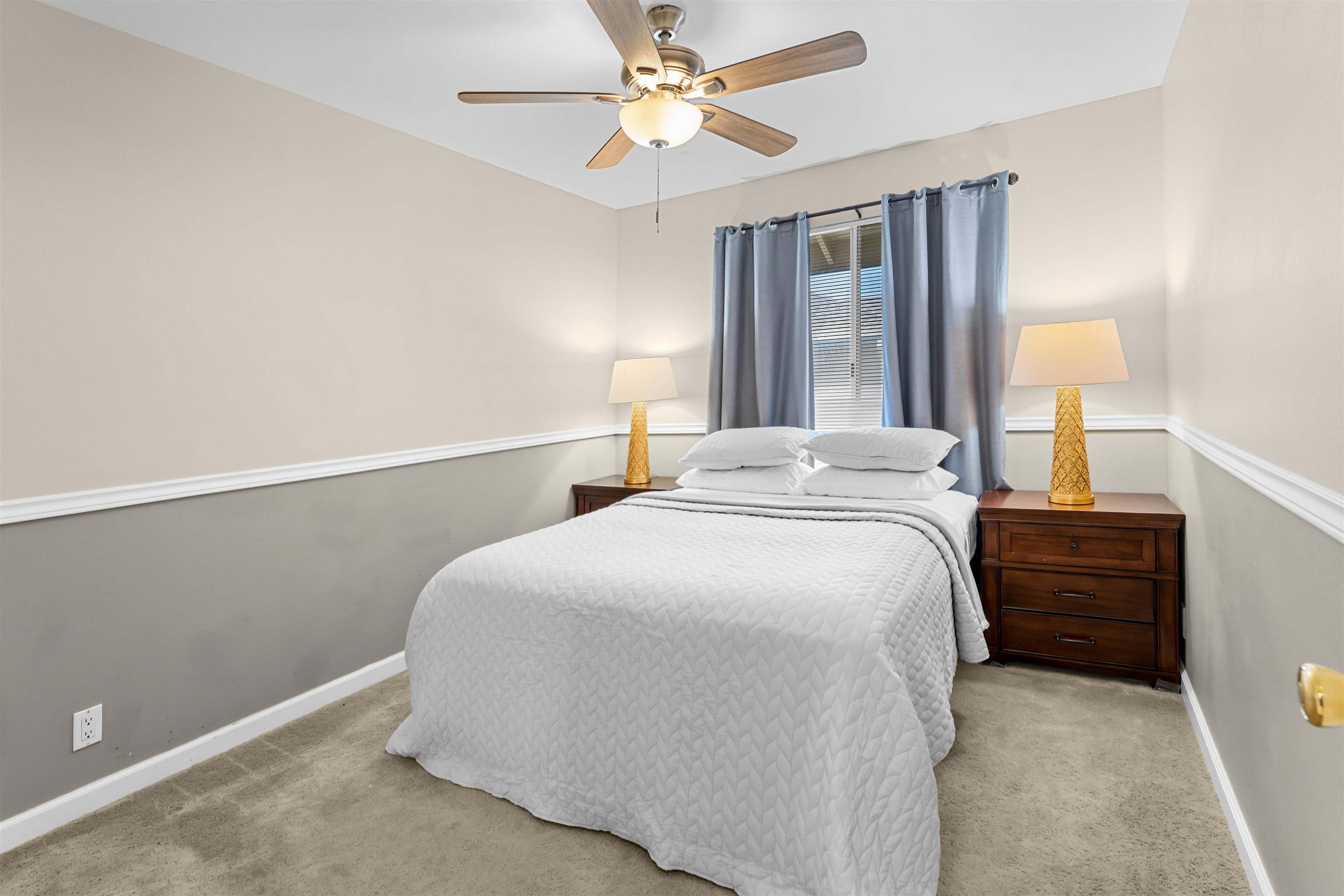 480 Kenolio Road, Unit 1203 Kihei, HI 96753 - Photo 11 of 17 a bedroom with a bed and a chandelier