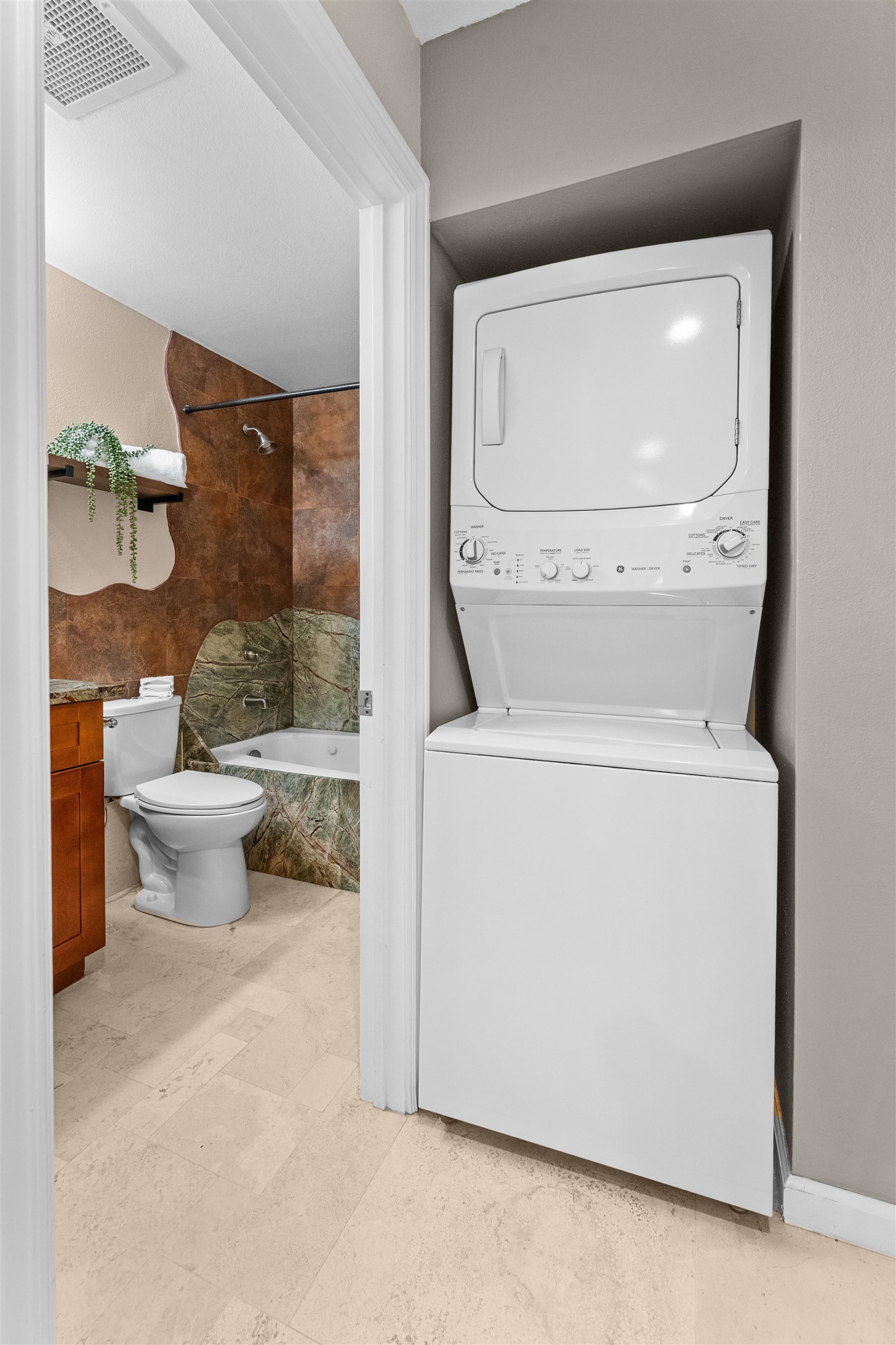 480 Kenolio Road, Unit 1203 Kihei, HI 96753 - Photo 12 of 17 a bathroom with a toilet and a shower