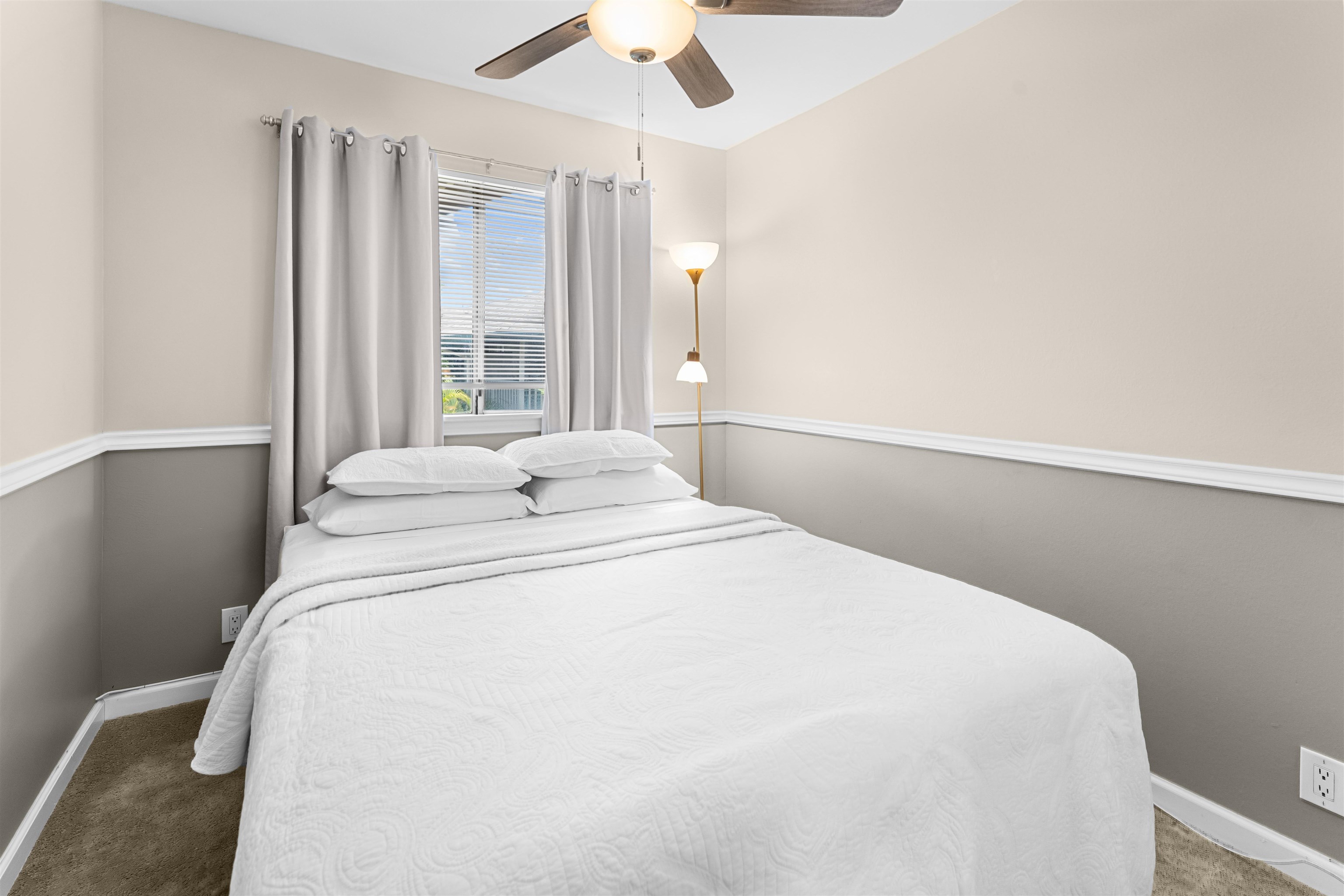 480 Kenolio Road, Unit 1203 Kihei, HI 96753 - Photo 10 of 17 a large bed sitting in a bedroom next to a window