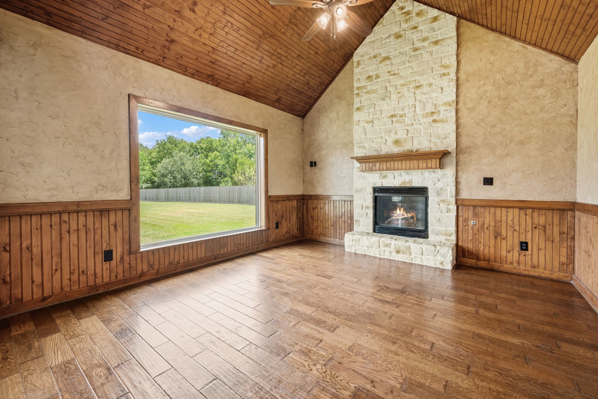 5041 Rimrock Pass Montgomery, TX 77316 - Photo 12 of 44 A second living room with a gas fireplace....also with an oversized window looking into the backyard