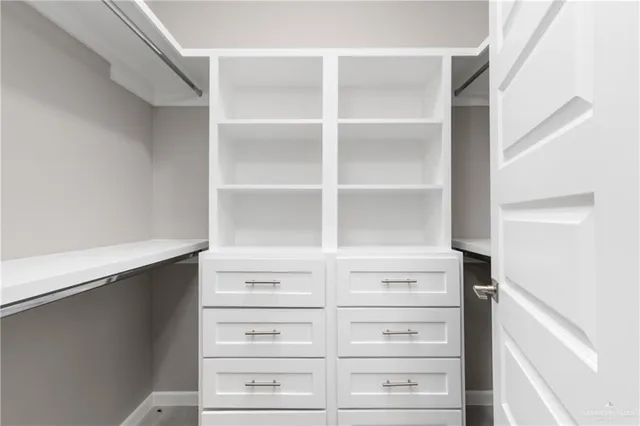 a view of an empty walk in closet