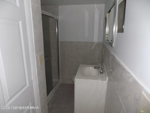 a bathroom with a sink and mirror