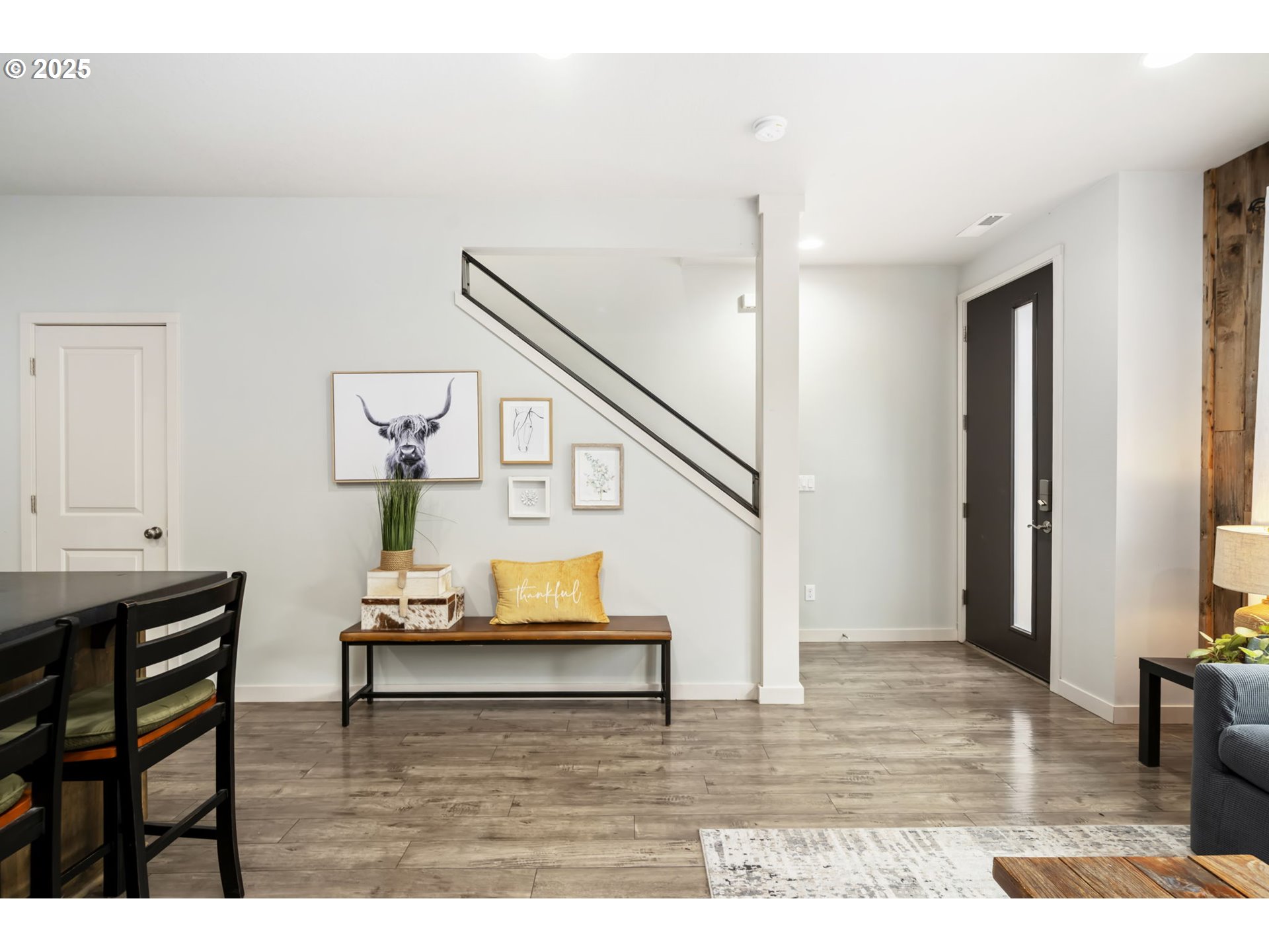 125 North 44th Place Ridgefield, WA 98642 - Photo 11 of 47 a living room with furniture and a wooden floor