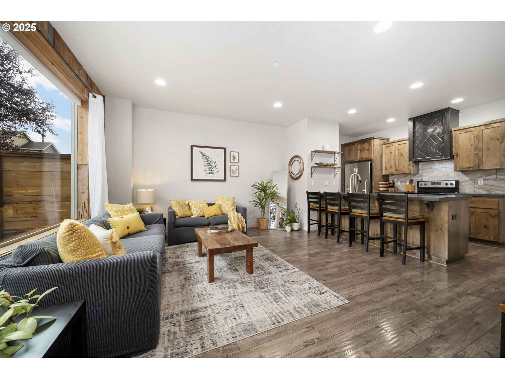 125 North 44th Place Ridgefield, WA 98642 - Photo 17 of 47 a living room with lots of furniture and kitchen view