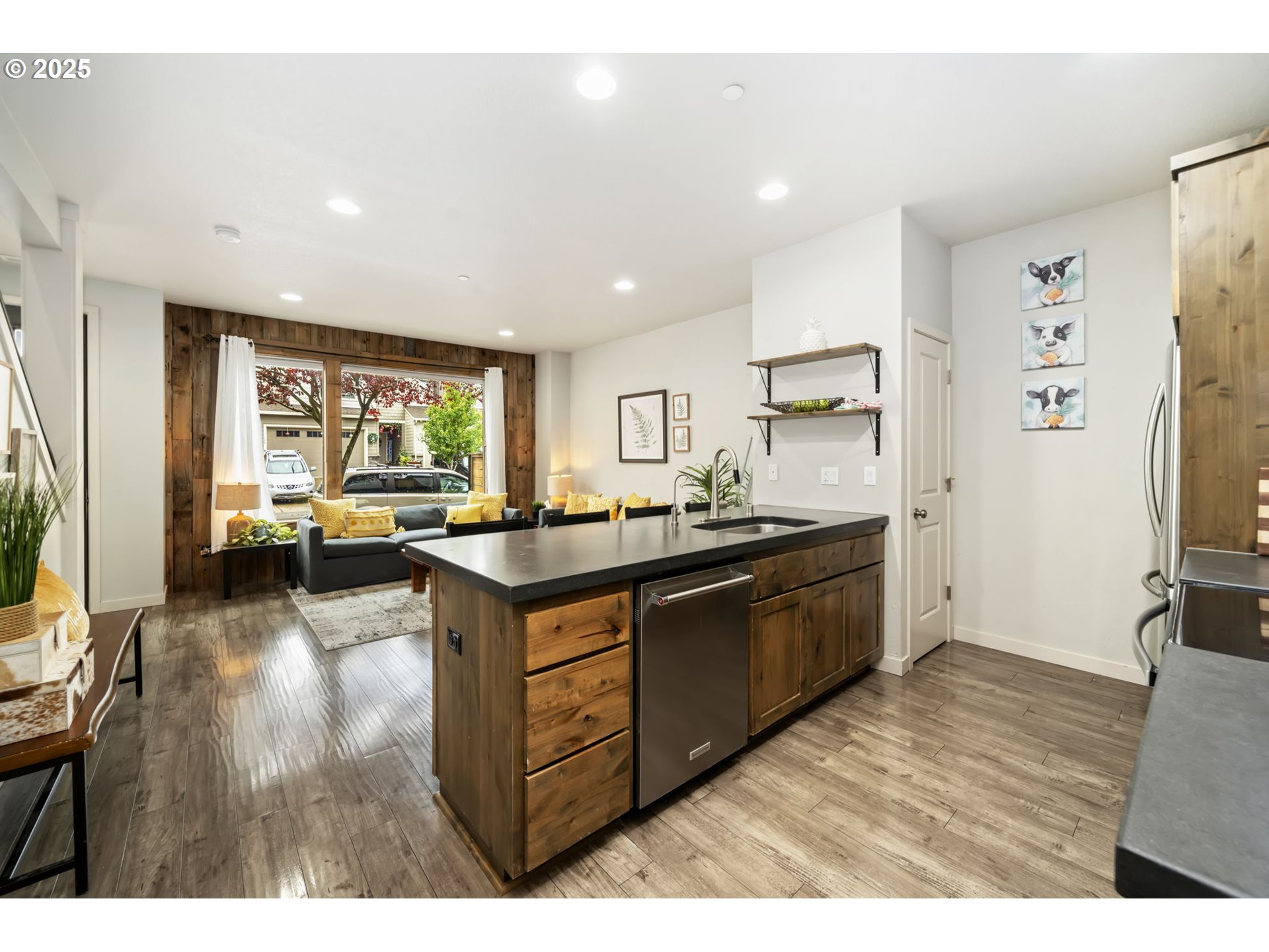 125 North 44th Place Ridgefield, WA 98642 - Photo 20 of 47 a kitchen with stainless steel appliances granite countertop a lot of cabinets and wooden floor