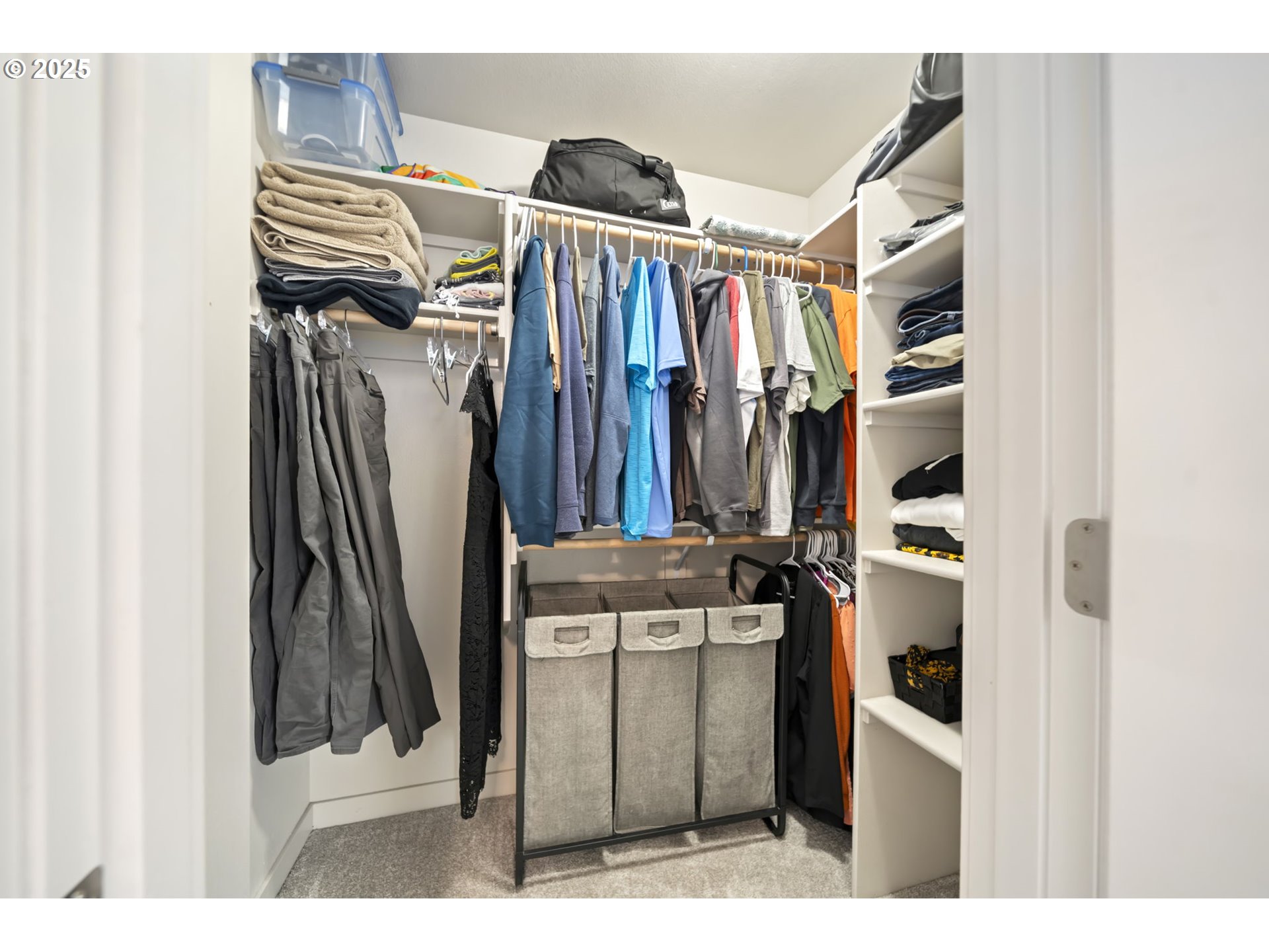 125 North 44th Place Ridgefield, WA 98642 - Photo 30 of 47 a view of walk in closet with clothes and shoes