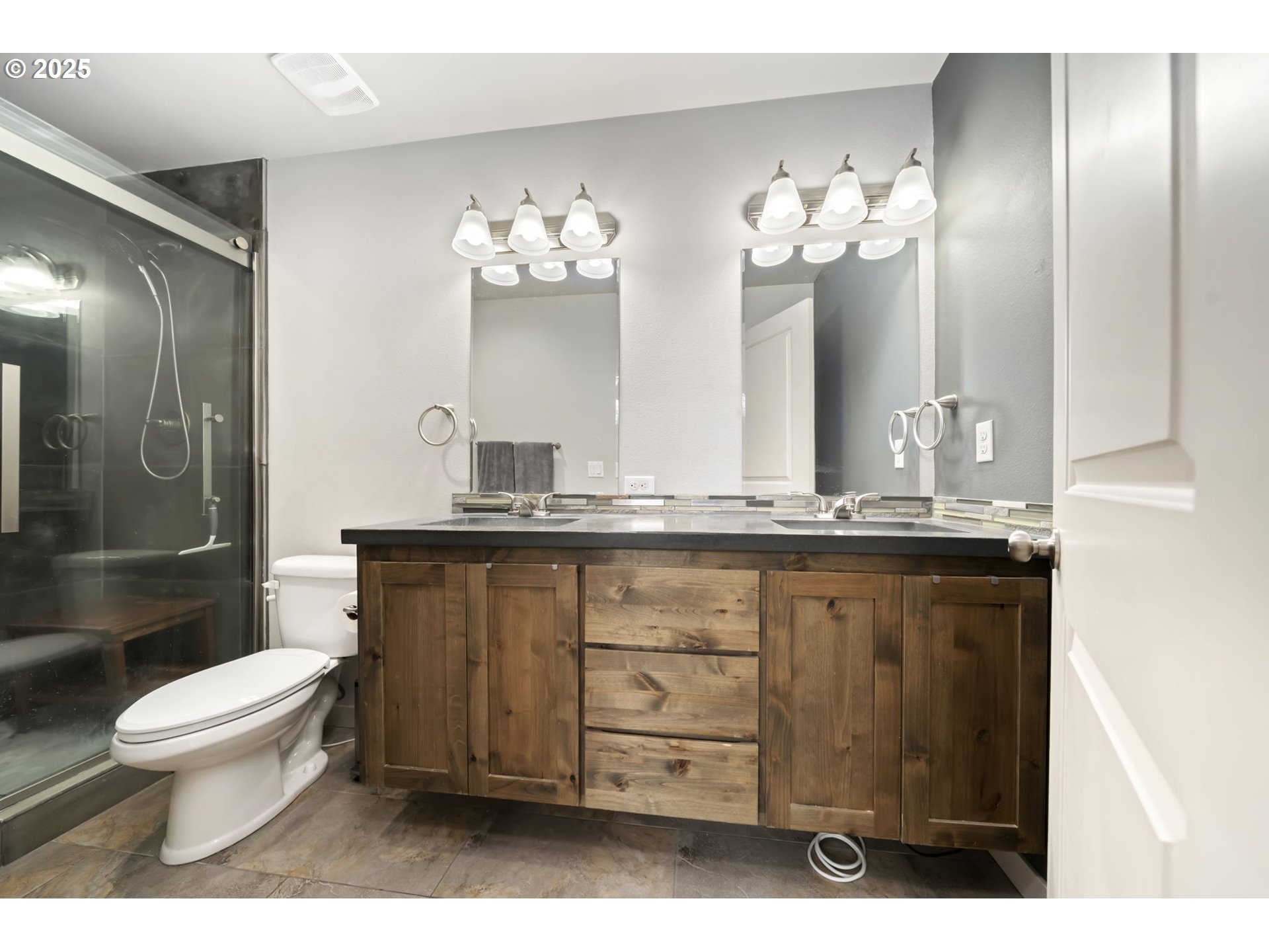 125 North 44th Place Ridgefield, WA 98642 - Photo 31 of 47 a bathroom with a sink vanity mirror and toilet