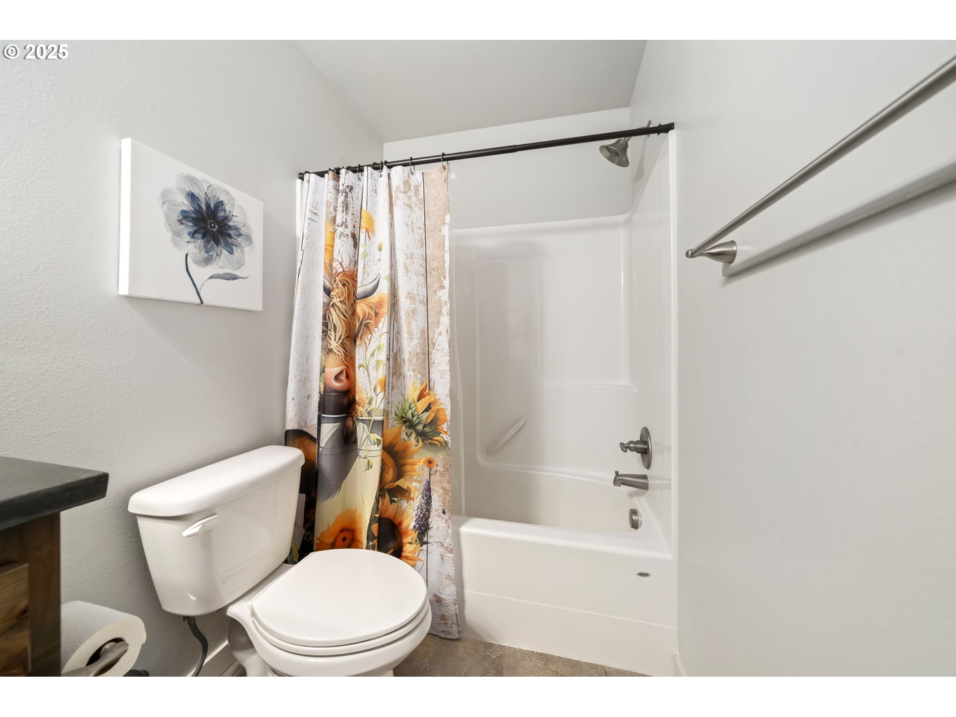 125 North 44th Place Ridgefield, WA 98642 - Photo 37 of 47 a white toilet sitting next to a bathroom sink and a shower