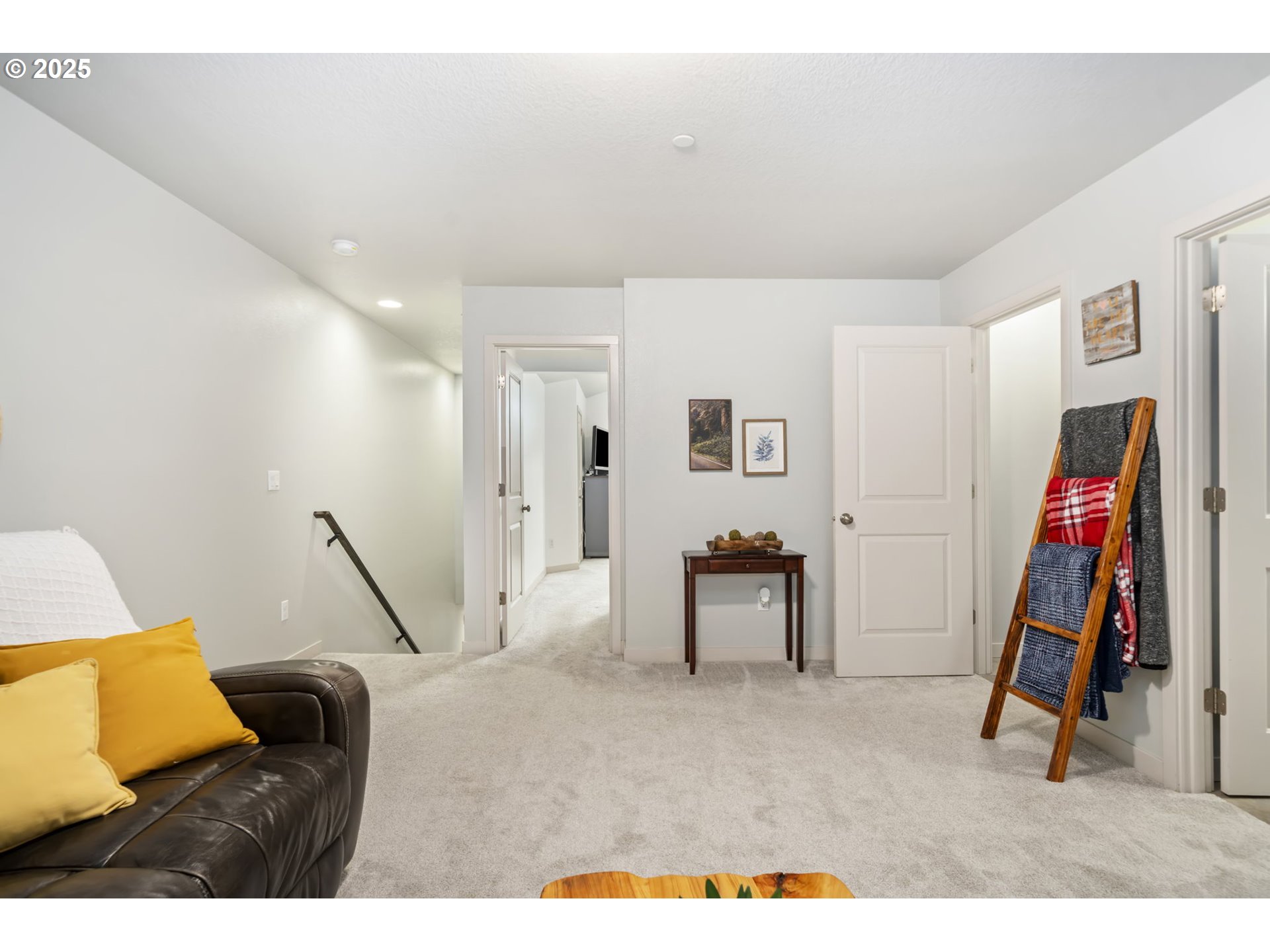 125 North 44th Place Ridgefield, WA 98642 - Photo 42 of 47 a living room with furniture and a flat screen tv