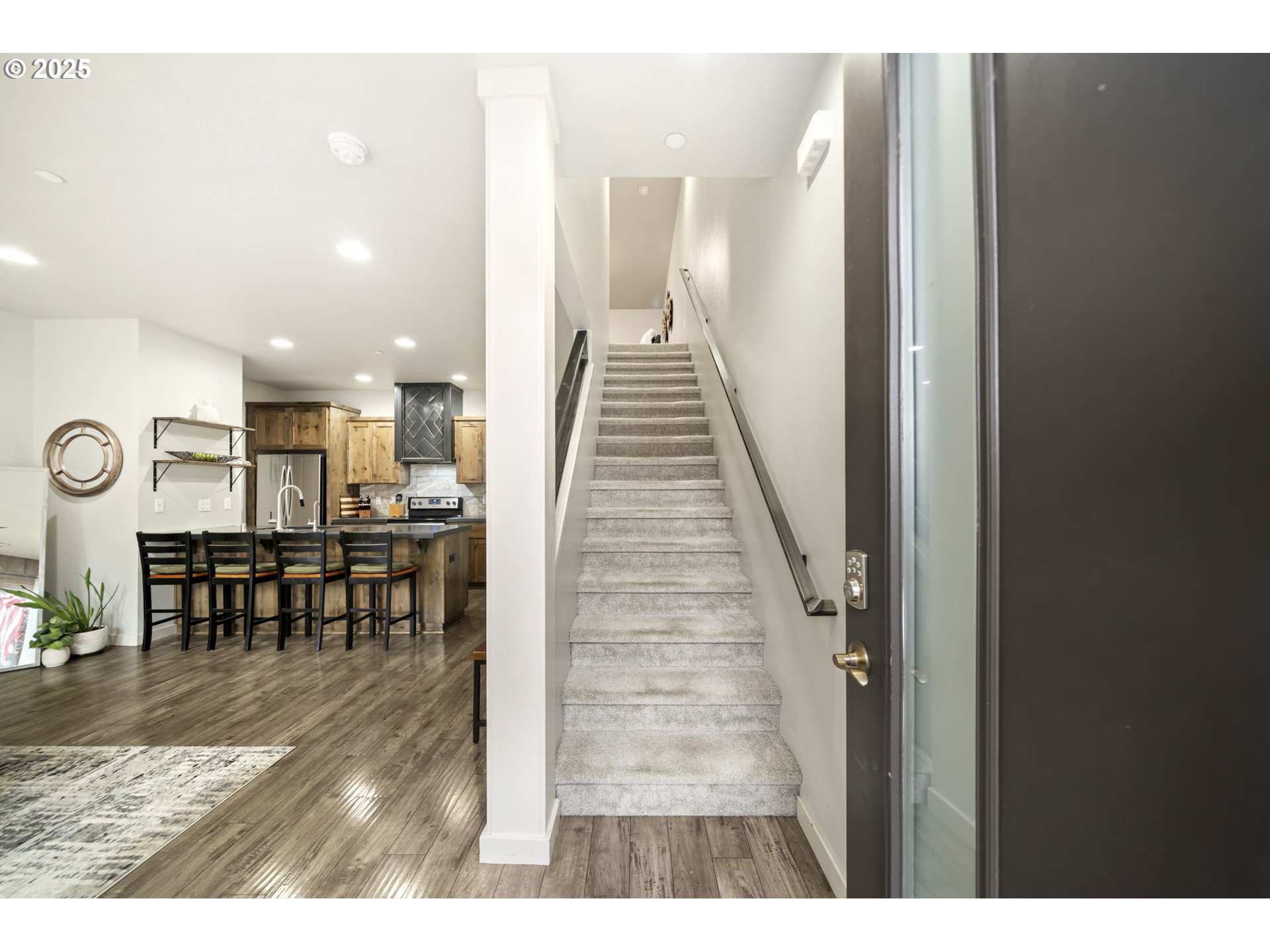 125 North 44th Place Ridgefield, WA 98642 - Photo 8 of 47 a view of dining room with furniture and a chandelier