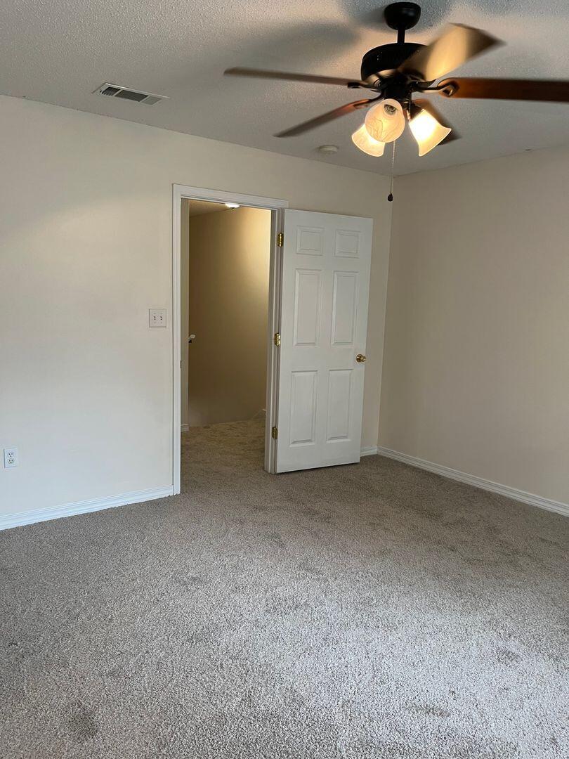 202 Johnson Court Crestview, FL 32536 - Photo 11 of 24 a view of a room with a fan