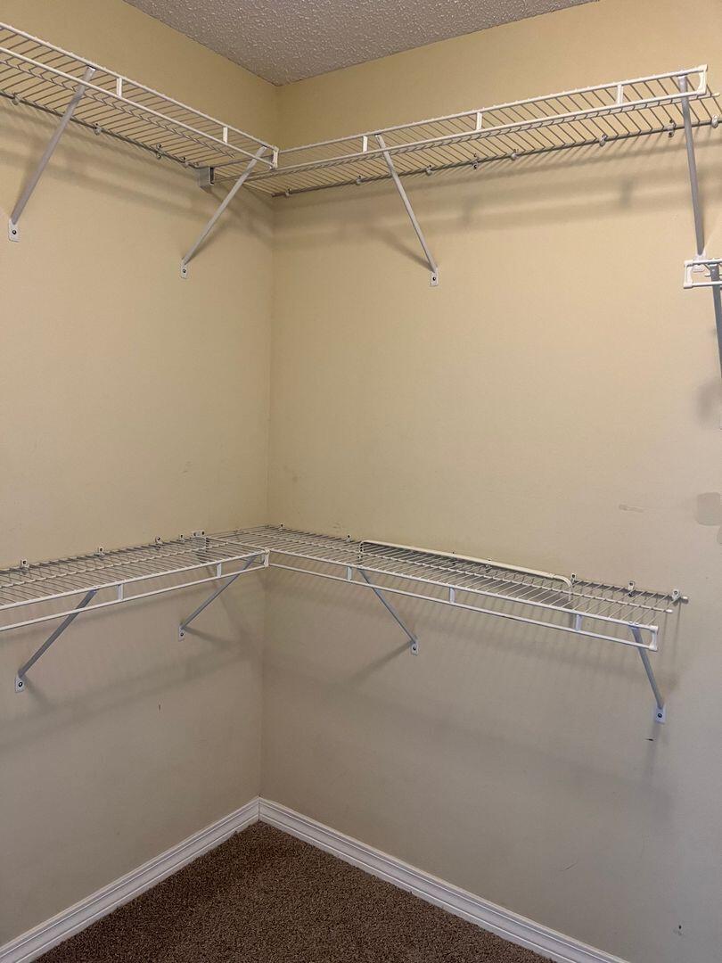 202 Johnson Court Crestview, FL 32536 - Photo 12 of 24 a view of a room with racks on the wall