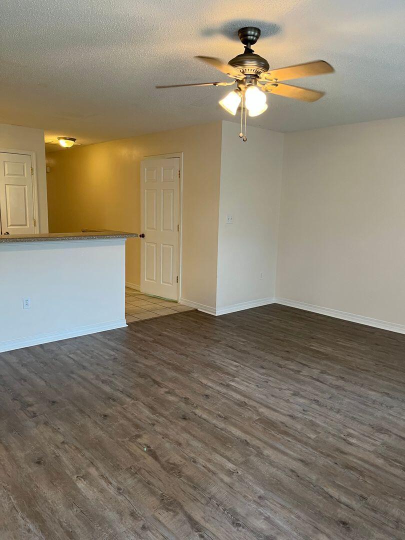 202 Johnson Court Crestview, FL 32536 - Photo 4 of 24 a view of empty room with wooden floor
