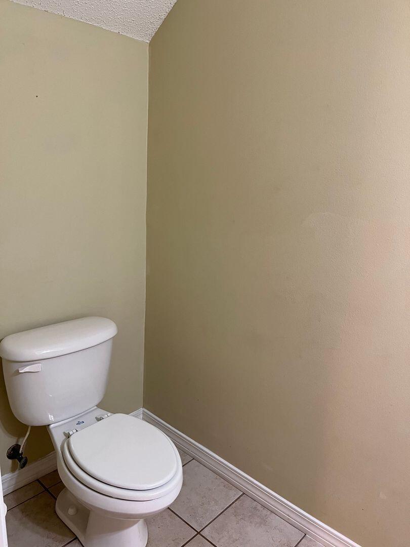 202 Johnson Court Crestview, FL 32536 - Photo 7 of 24 a white toilet sitting next to a white wall