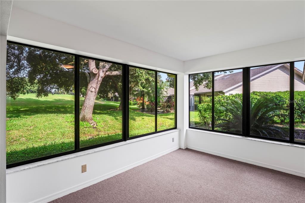 9108 Bassett Lane, Unit B New Port Richey, FL 34655 - Photo 19 of 66 a view of an empty room with a large window