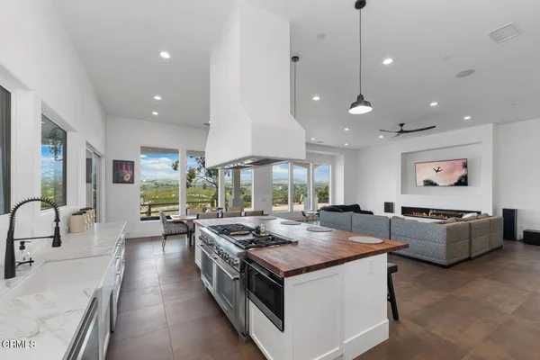 a kitchen with a table and chairs in it