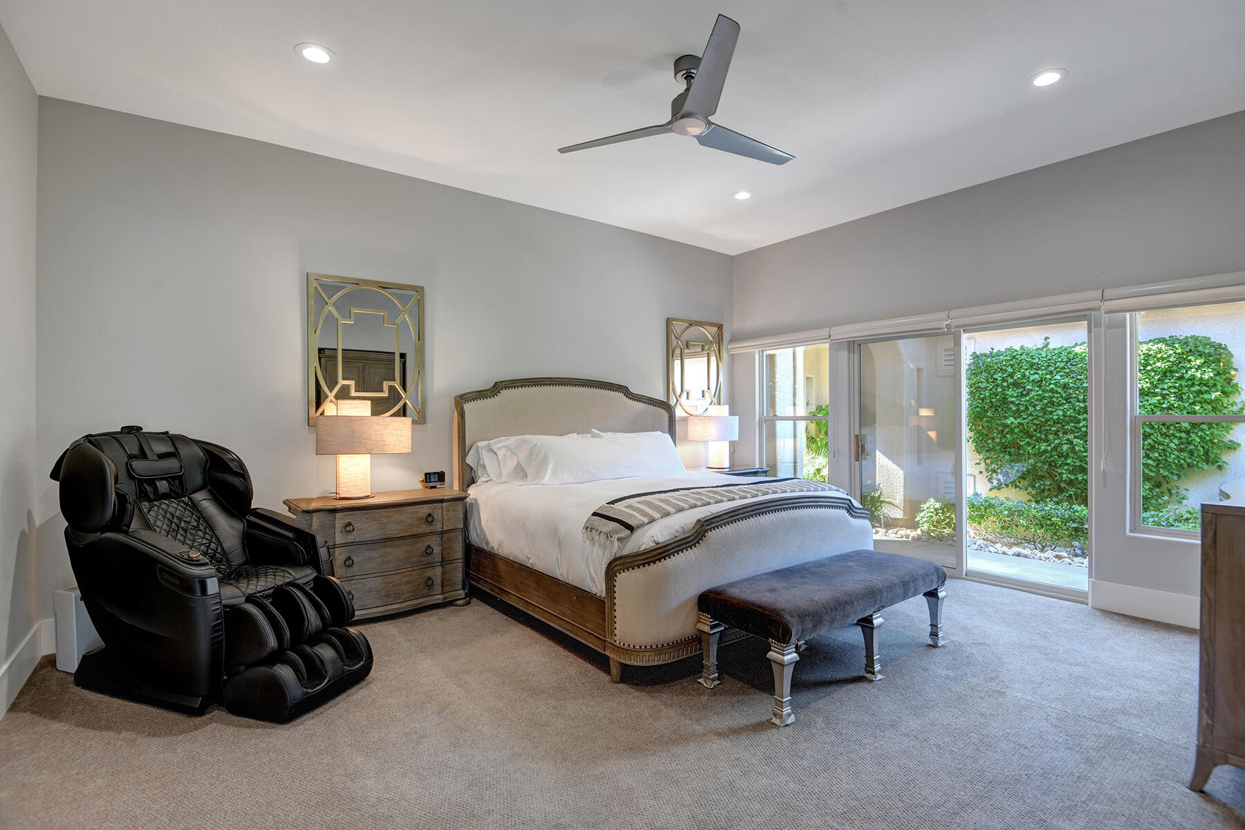 75 North Kavenish Drive Rancho Mirage, CA 92270 - Photo 16 of 41 a spacious bedroom with a bed and a couch