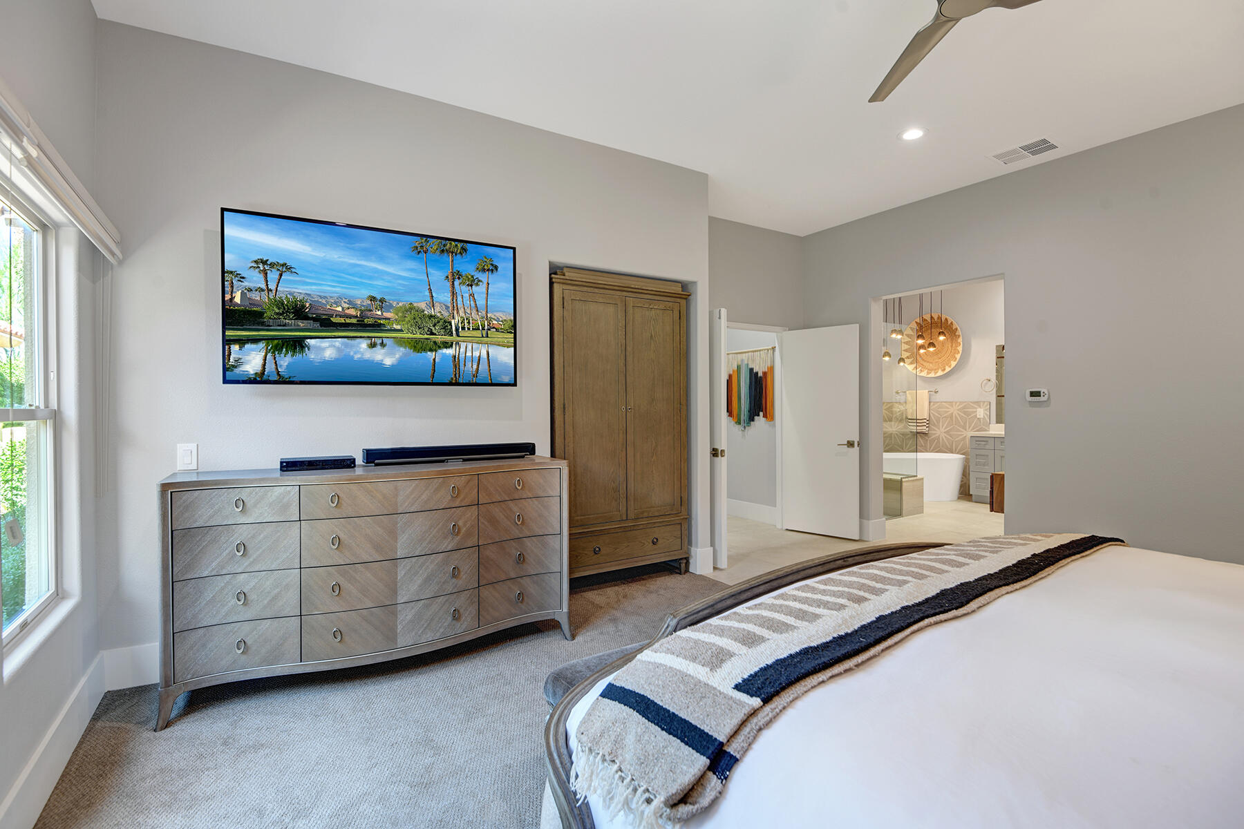 75 North Kavenish Drive Rancho Mirage, CA 92270 - Photo 17 of 41 a bedroom with a bed and a window