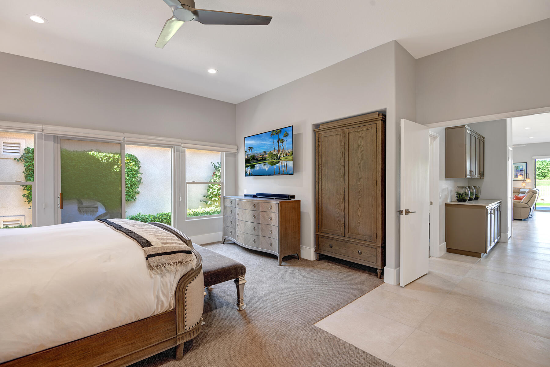 75 North Kavenish Drive Rancho Mirage, CA 92270 - Photo 18 of 41 a bed room with a bed and a large window