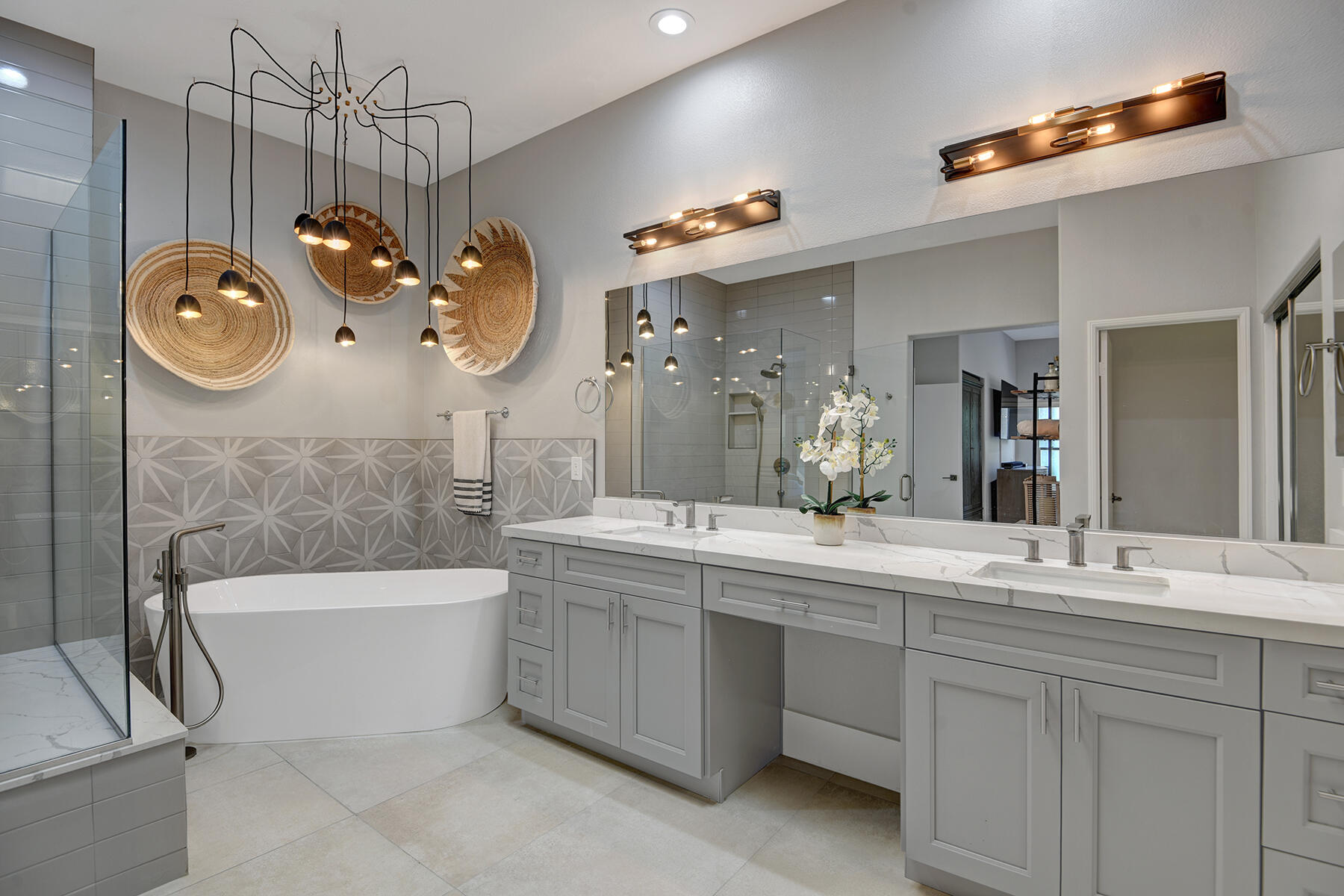 75 North Kavenish Drive Rancho Mirage, CA 92270 - Photo 19 of 41 a bathroom with a double vanity sink a mirror a bathtub and shower
