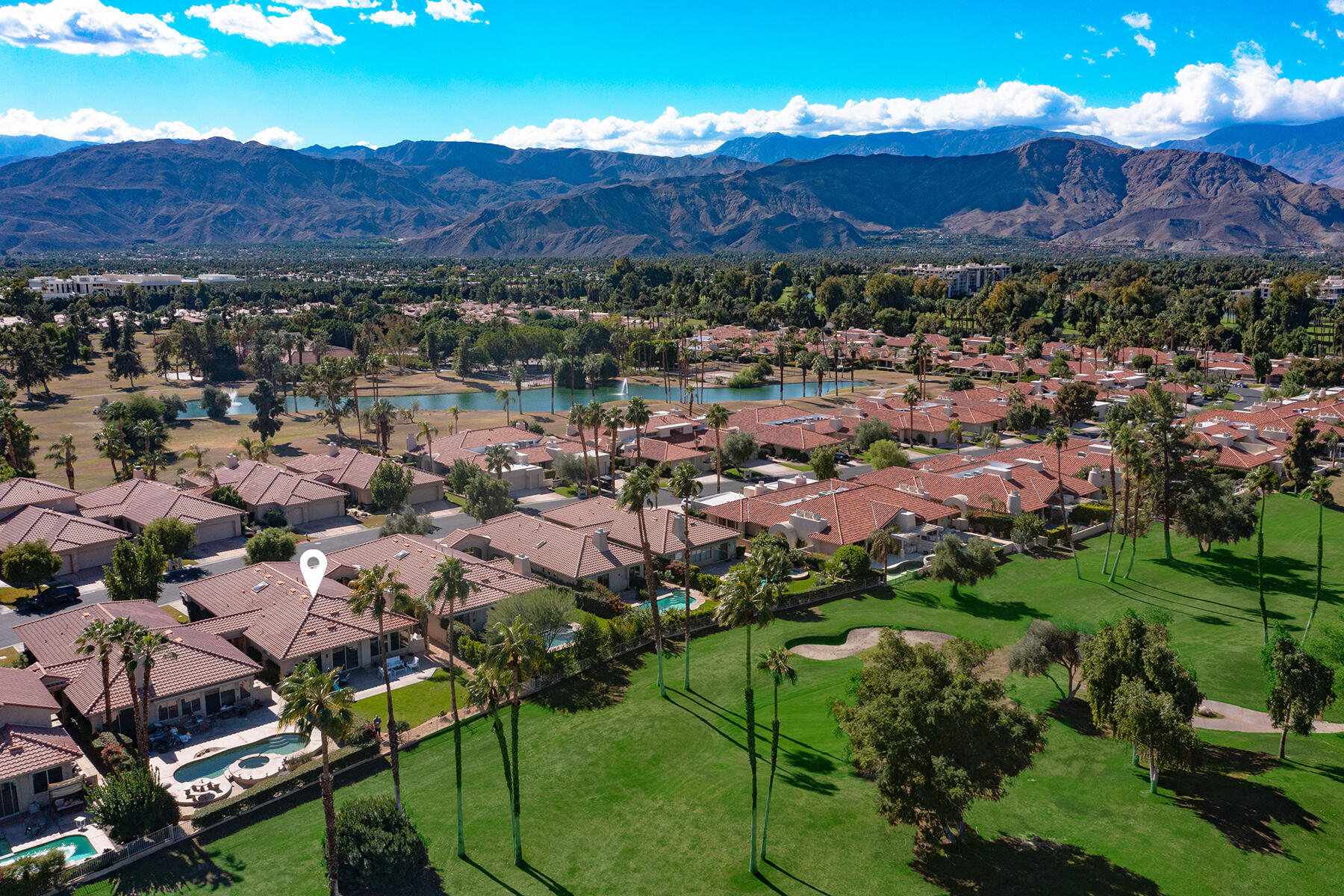 75 North Kavenish Drive Rancho Mirage, CA 92270 - Photo 2 of 41 an aerial view of residential house and sandy dunes