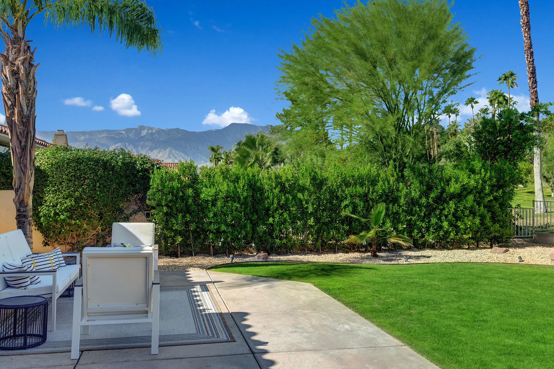 75 North Kavenish Drive Rancho Mirage, CA 92270 - Photo 34 of 41 a front view of a house with a yard
