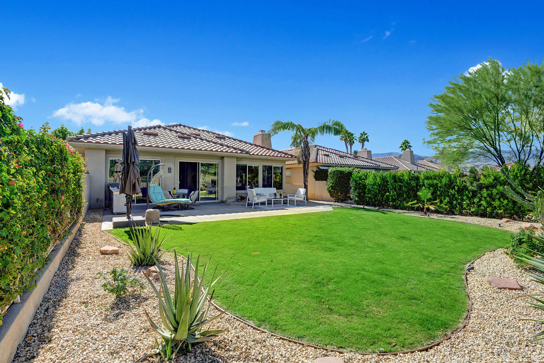 75 North Kavenish Drive Rancho Mirage, CA 92270 - Photo 35 of 41 a view of a house with swimming pool and porch